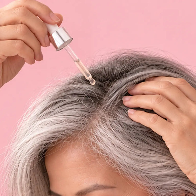 Part and apply - six to eight drops along the scalp and mid-lengths.